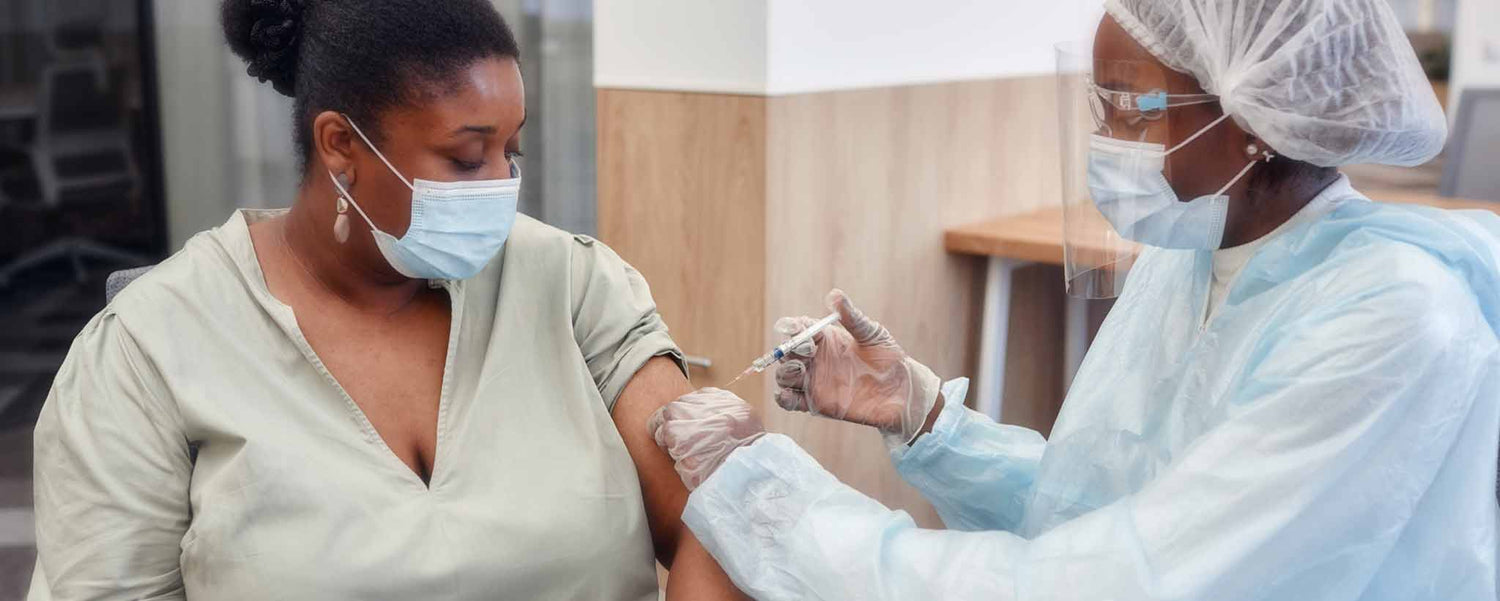 Black woman receives vaccination