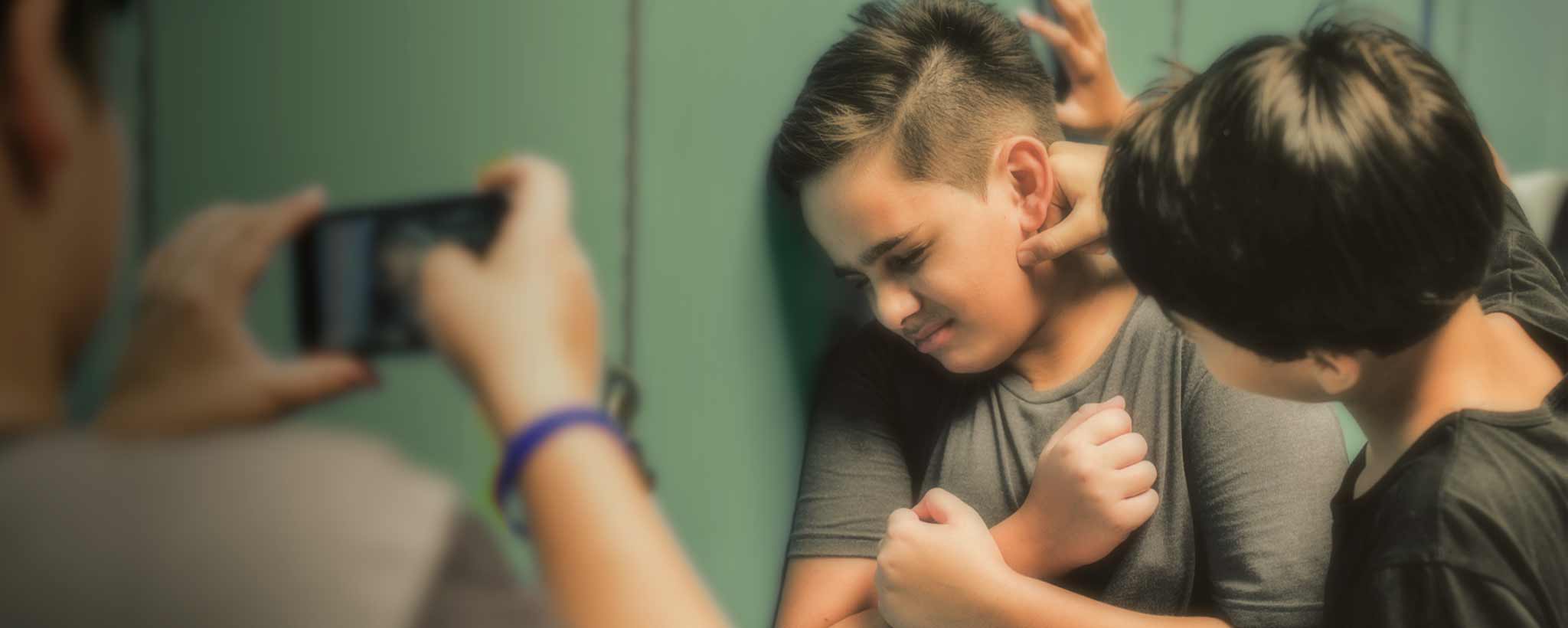 'A boy gets bullied by school lockers.'