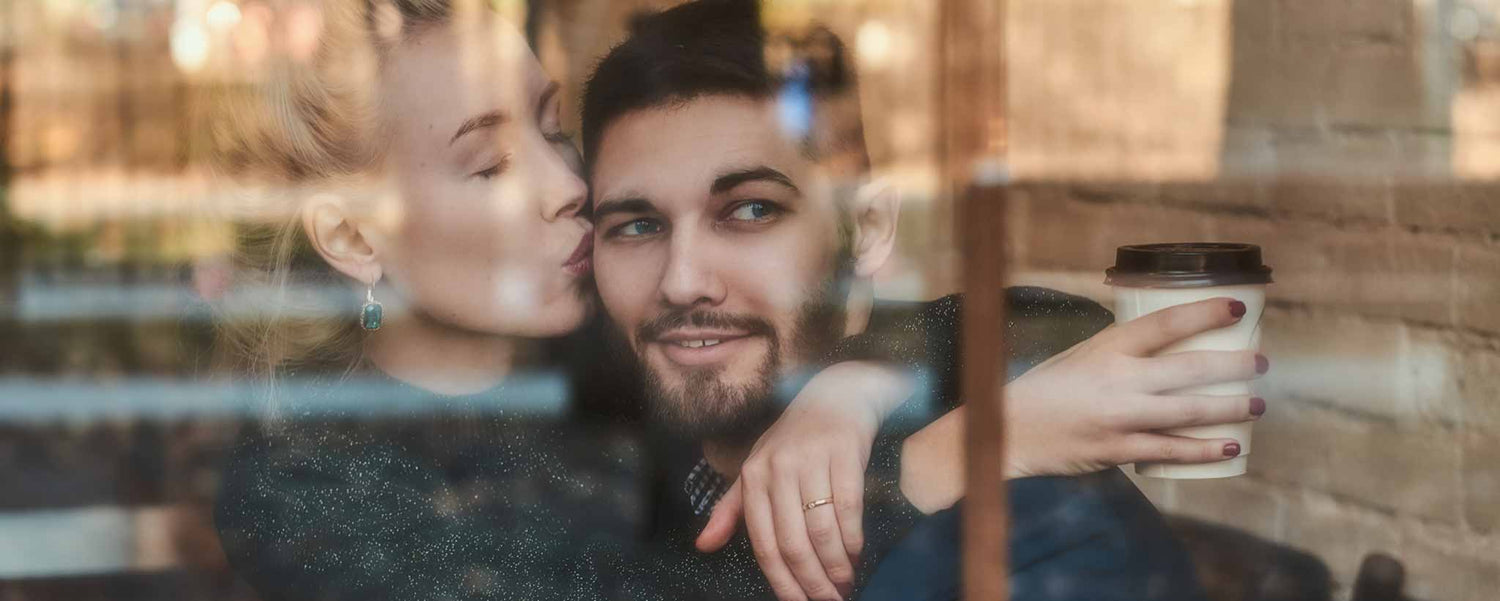 Romanic kiss in cafe window