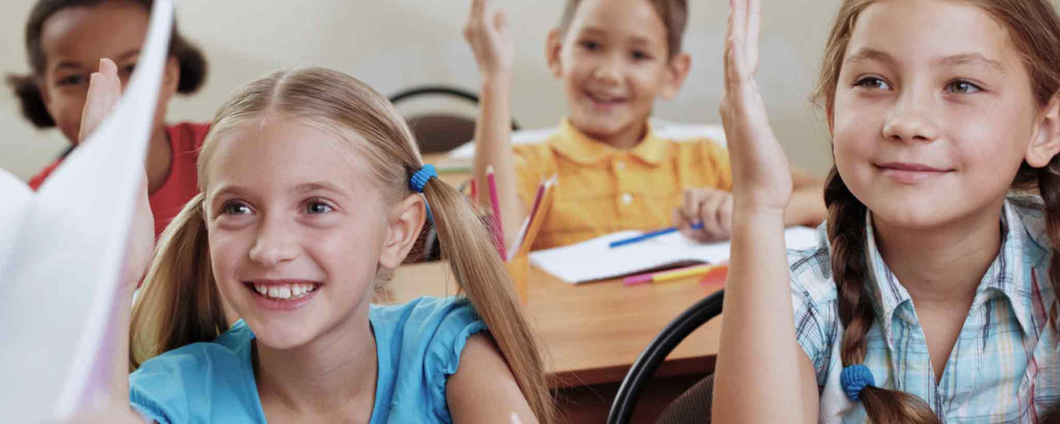 Young students raise hands
