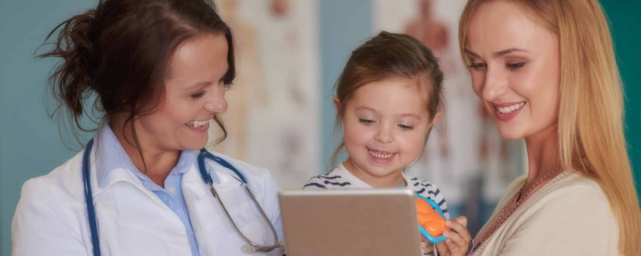 'Female doctor with toddler and mother'