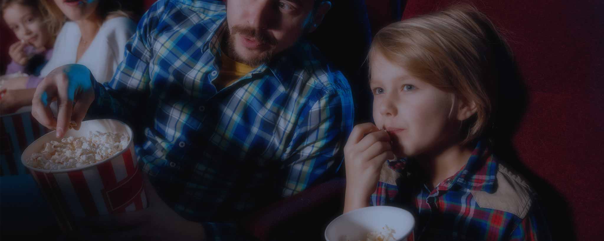 'Family watching movie in theater'