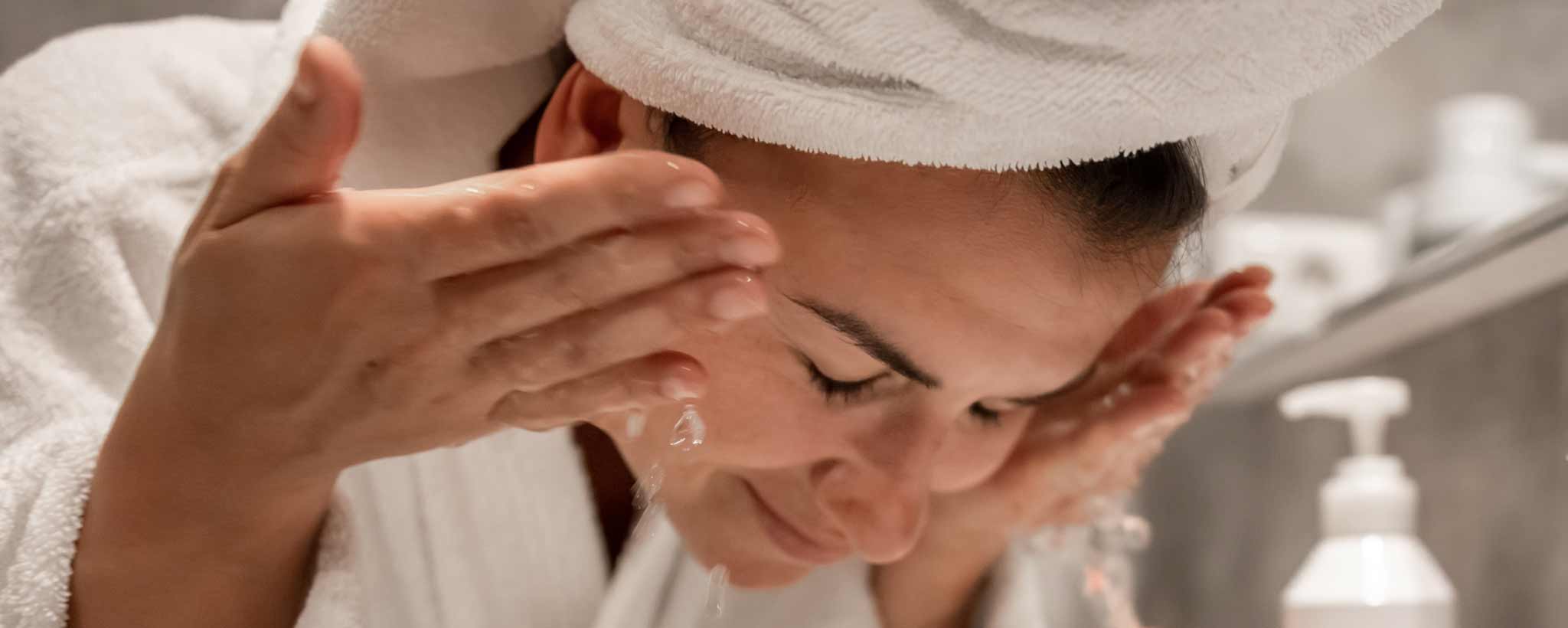 'Woman washing face'