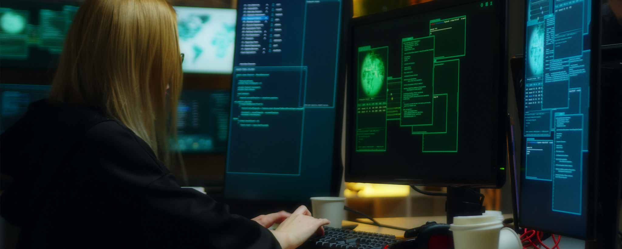 'Female hacker with computers'