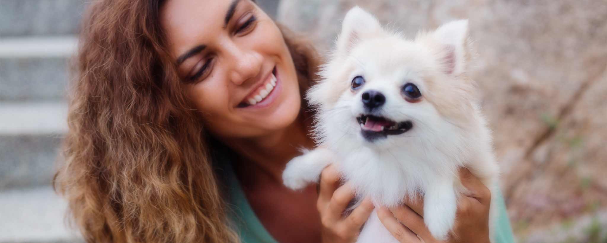 'Pretty woman with Pomeranian dog'