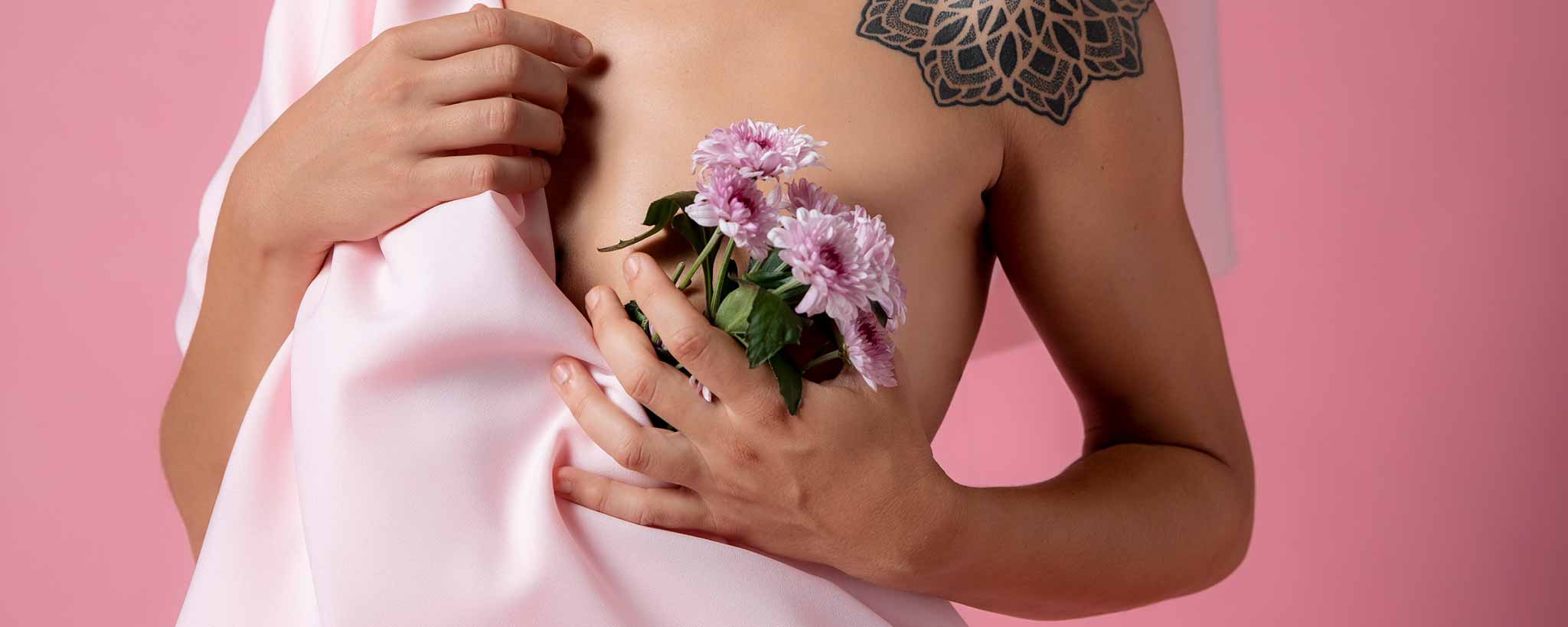'Post-mastectomy female holding flowers'