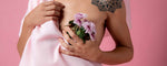 Post-mastectomy female holding flowers