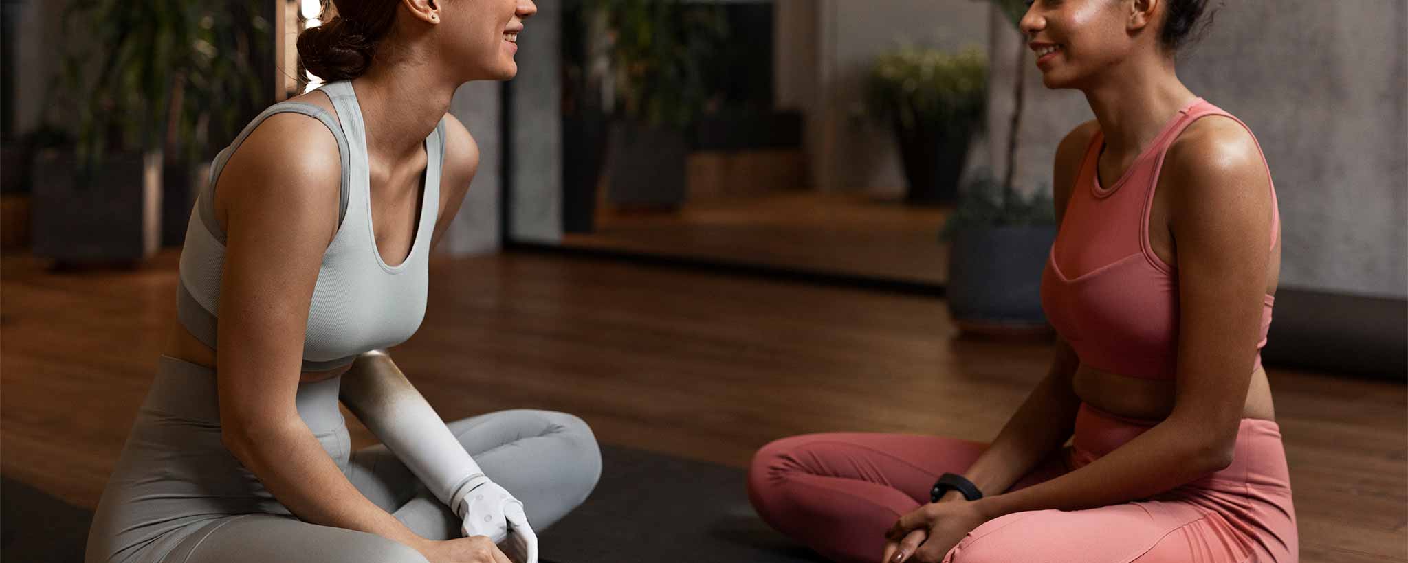 'A physical therapist works with a female that has a prosthesis.'