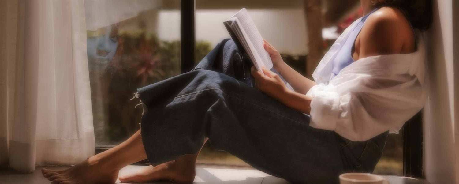 Seated female reading book