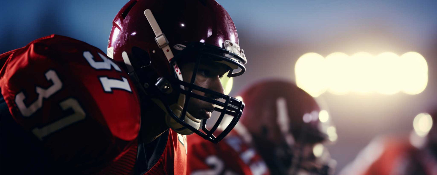 Football player in red uniform with number 37 on a field with lights in the background. (ai)