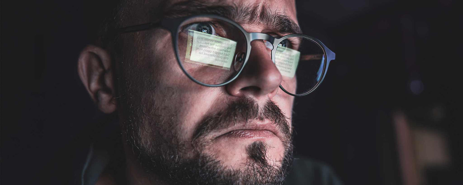 Man viewing computer at night