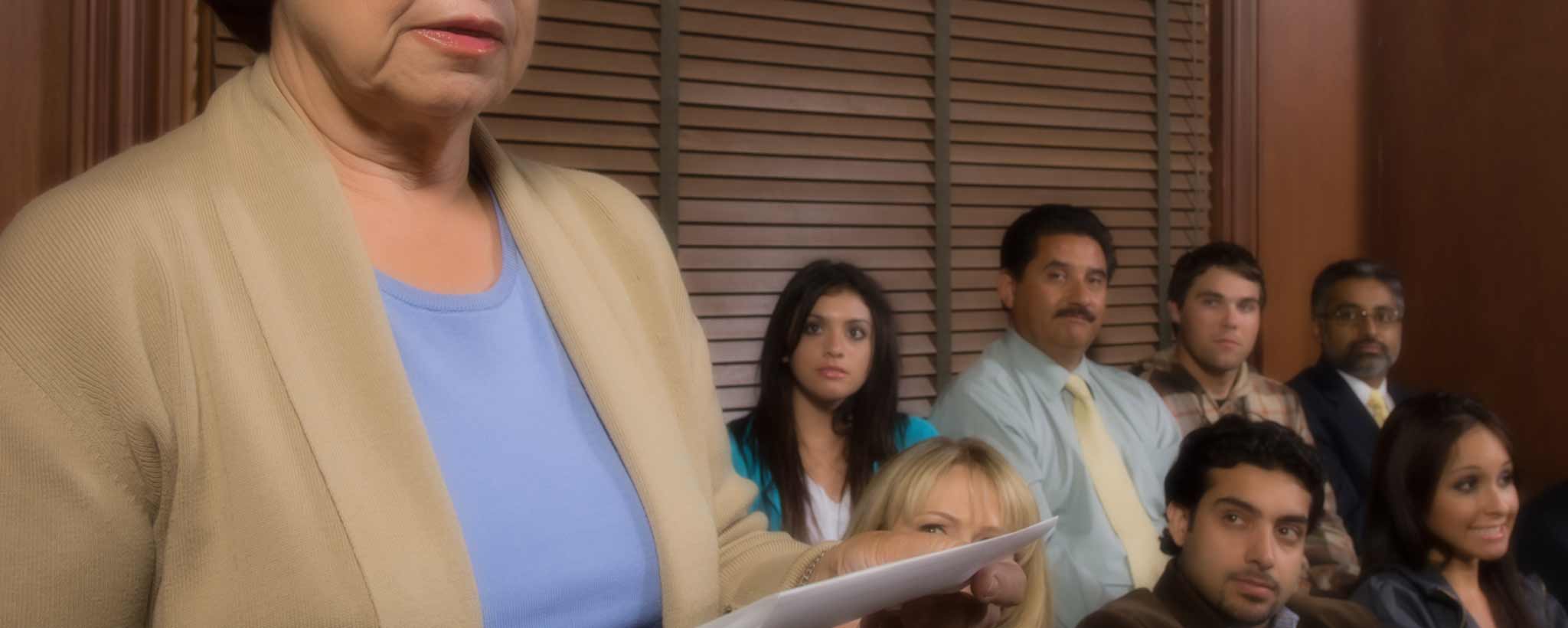 'A female jury foreperson reads the verdict.'
