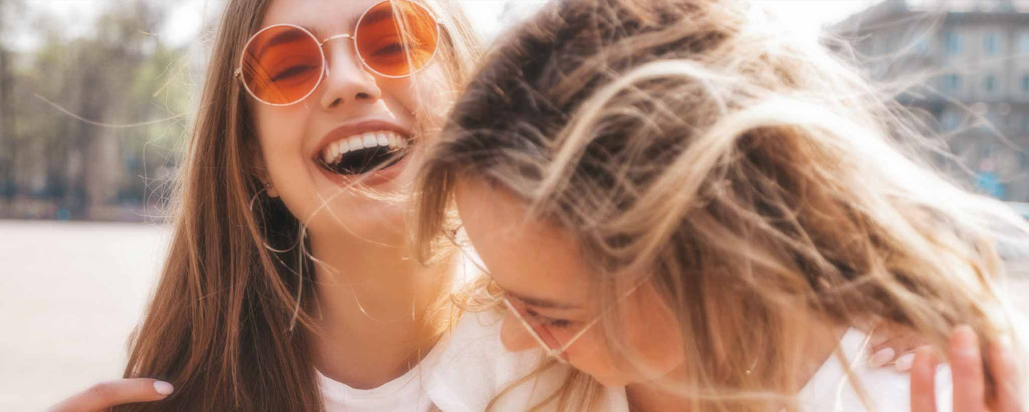 Two happy blonde schoolgirls.