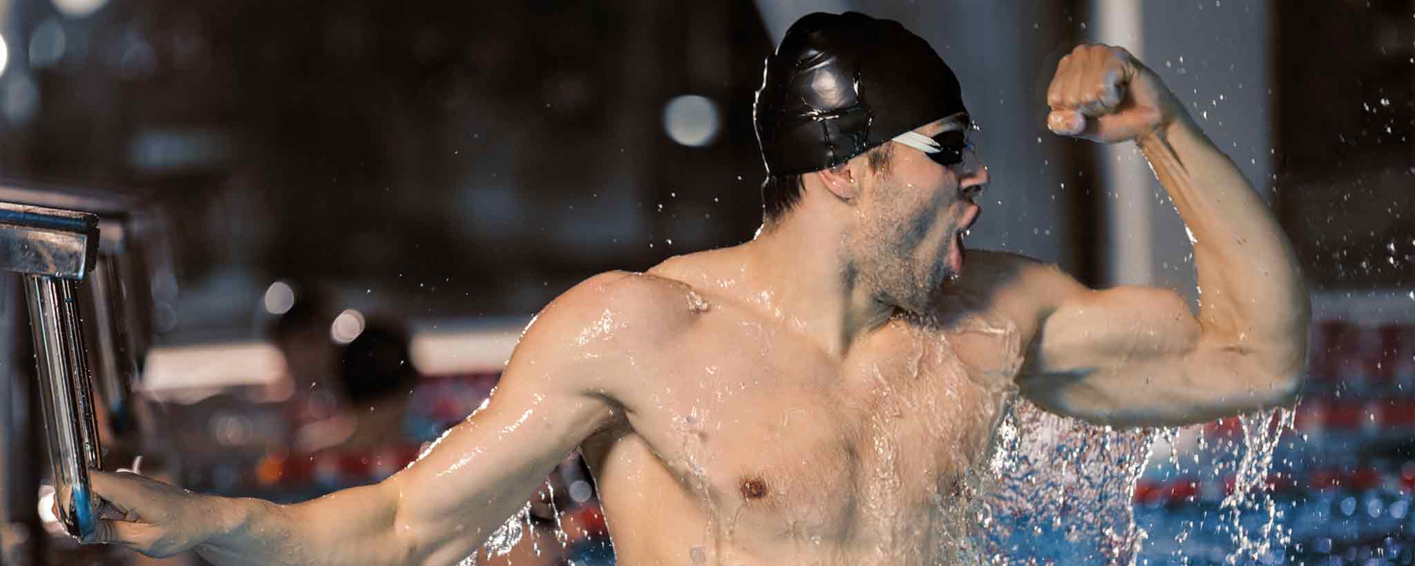 'Strong male swimmer in pool'