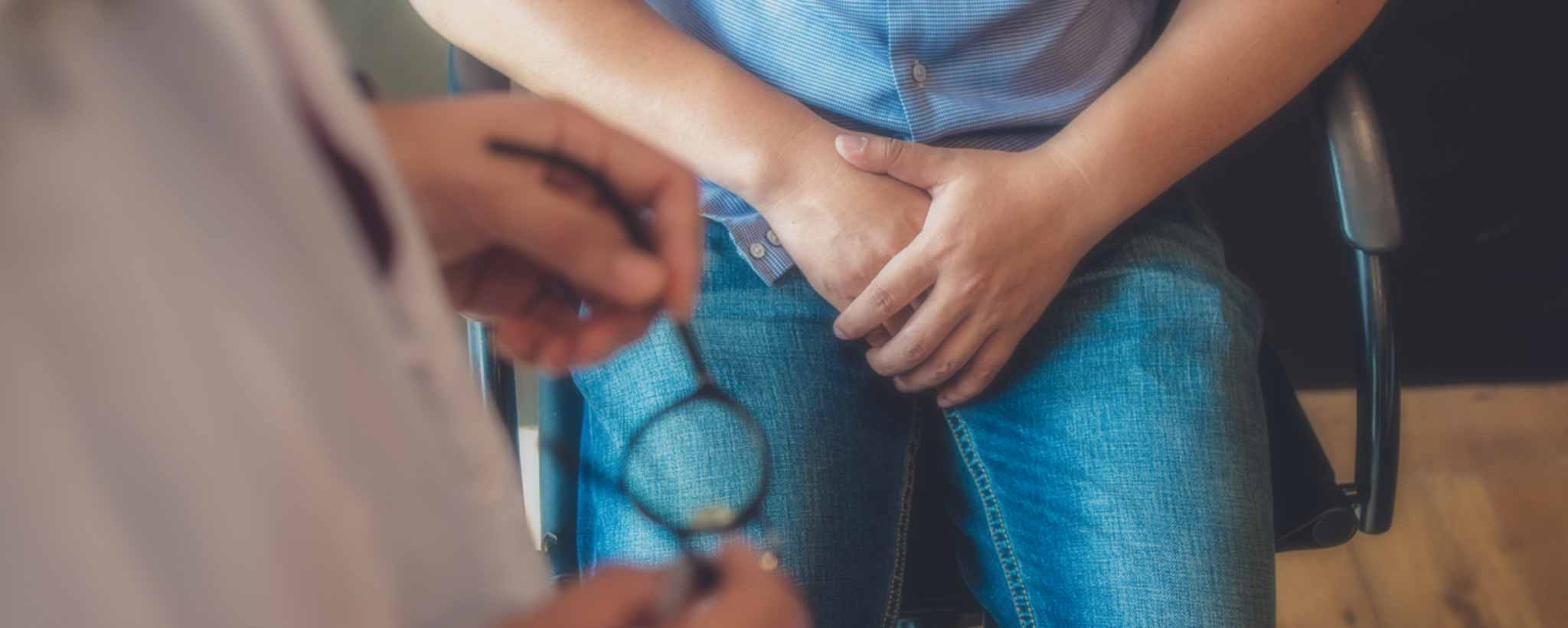 'Urology patient sitting in exam room'