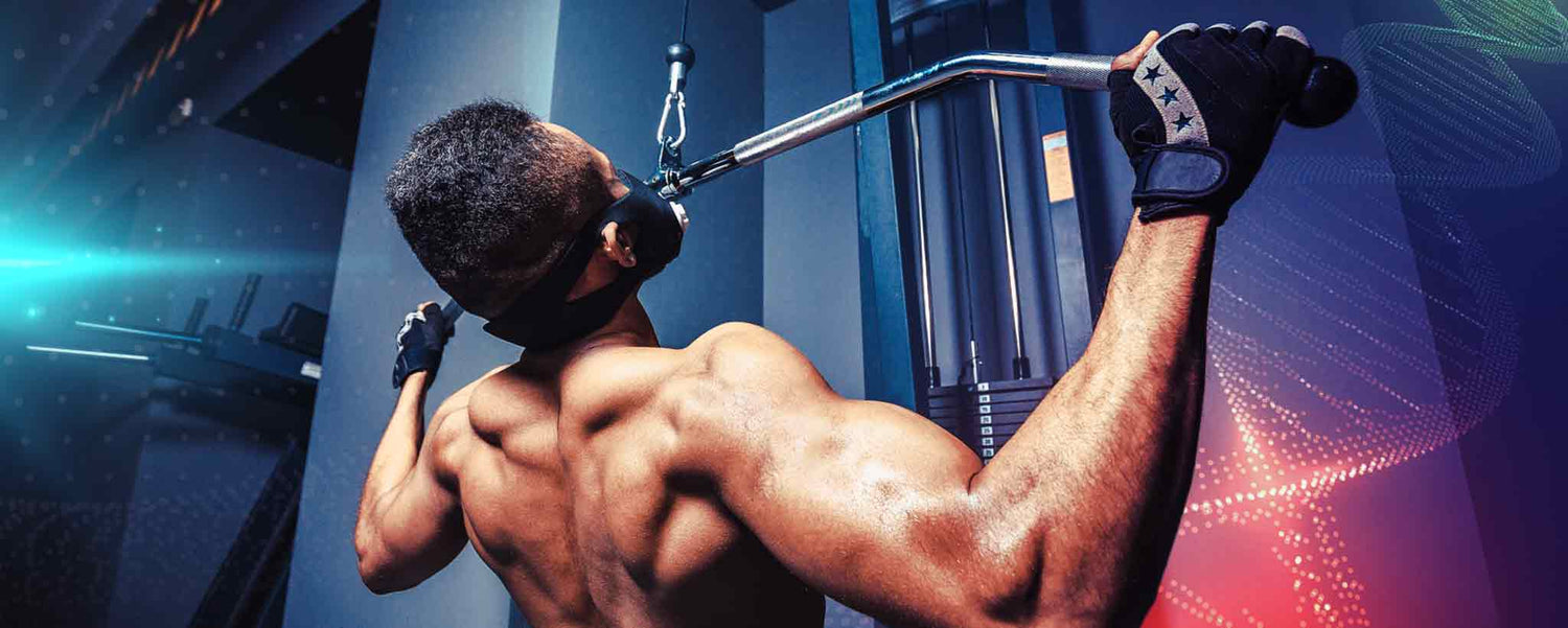 Masked male works out with pull-ups.