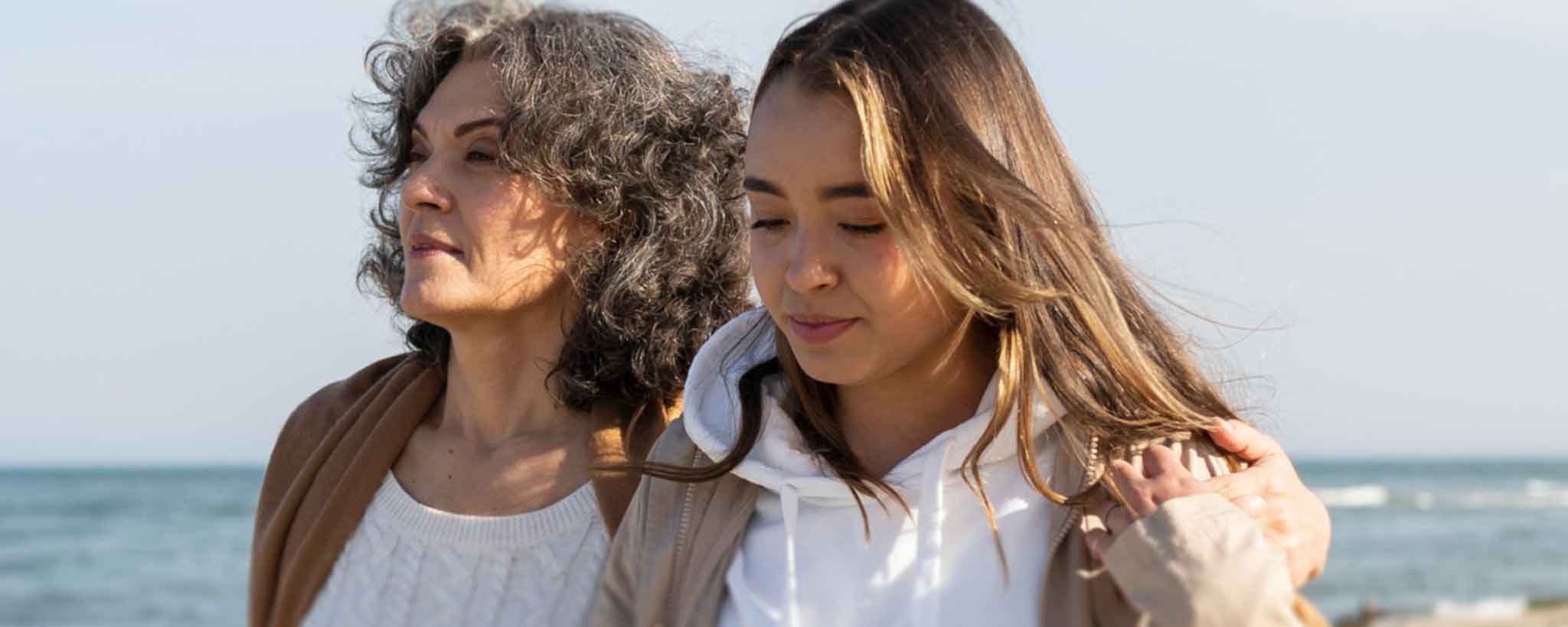 'Females walking on beach'