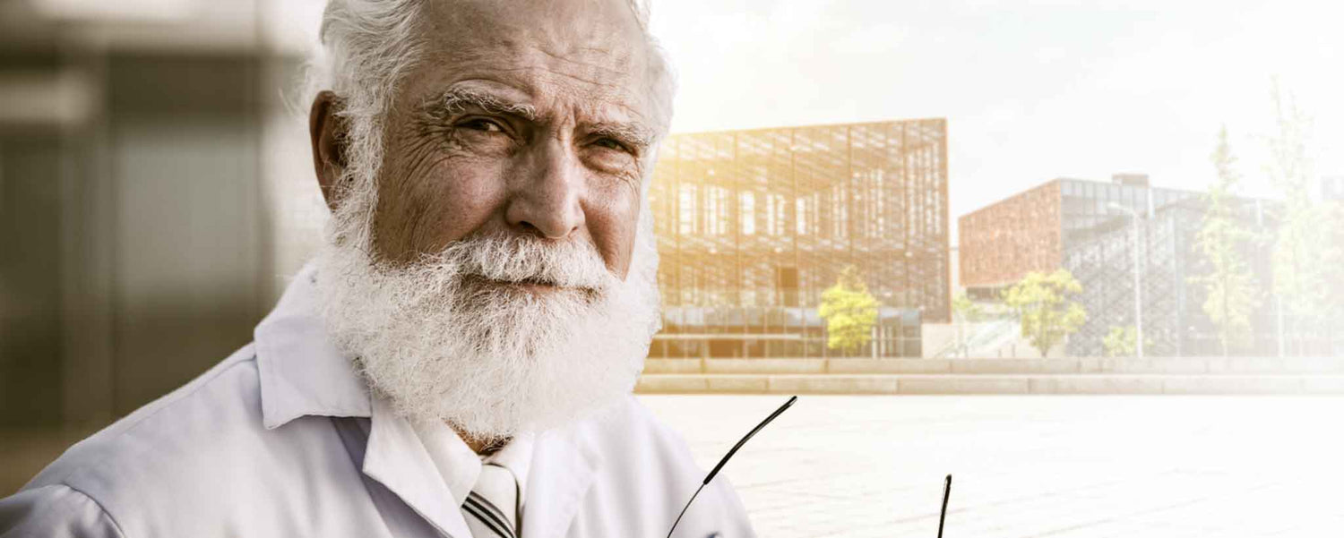 Elderly man viewing building plans
