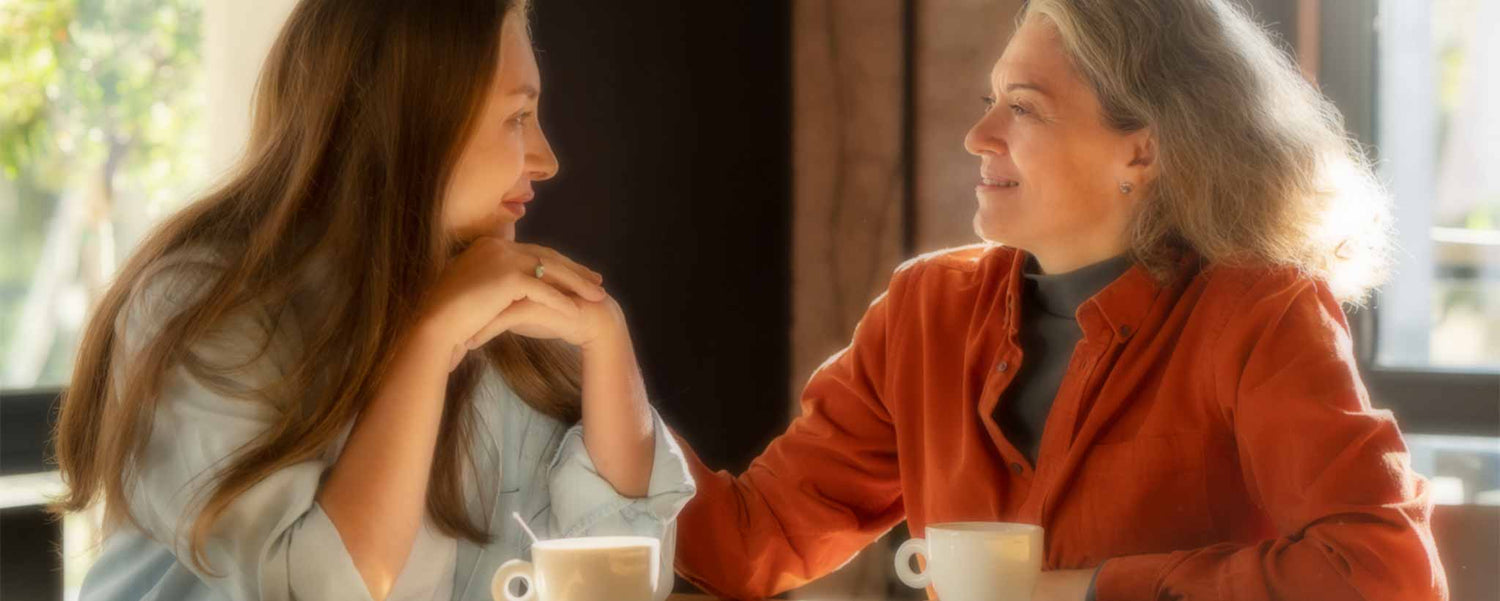 An adult daughter gets advice from her mature mother.