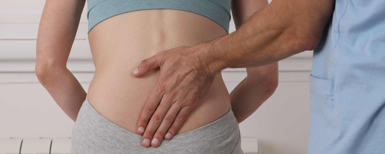 Osteopath touching back