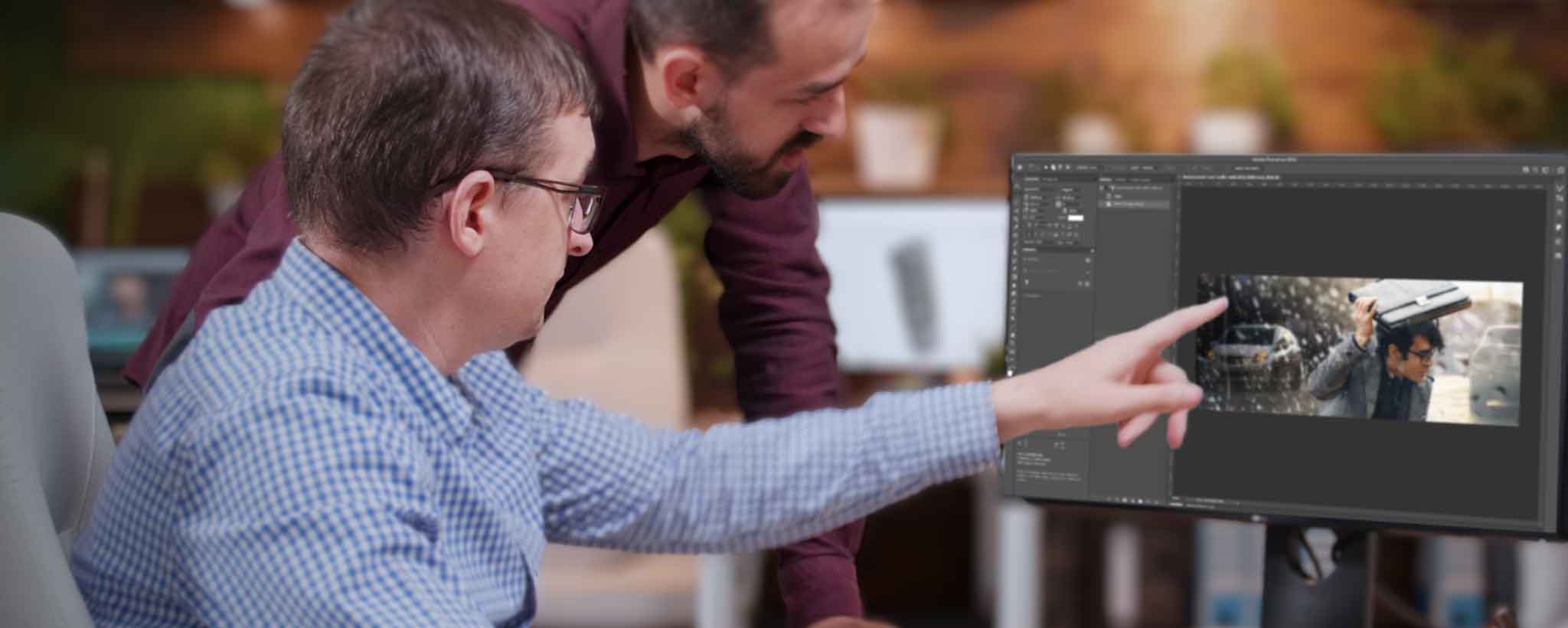 'Two men editing Photoshop image'