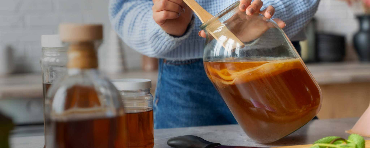 Female preparing kombucha