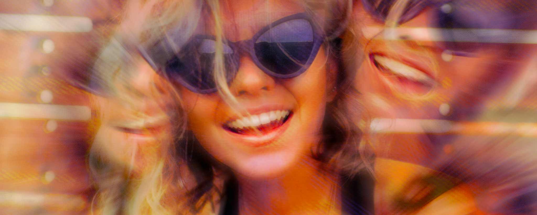 'A kaleidoscopic female wearing sunglasses.'