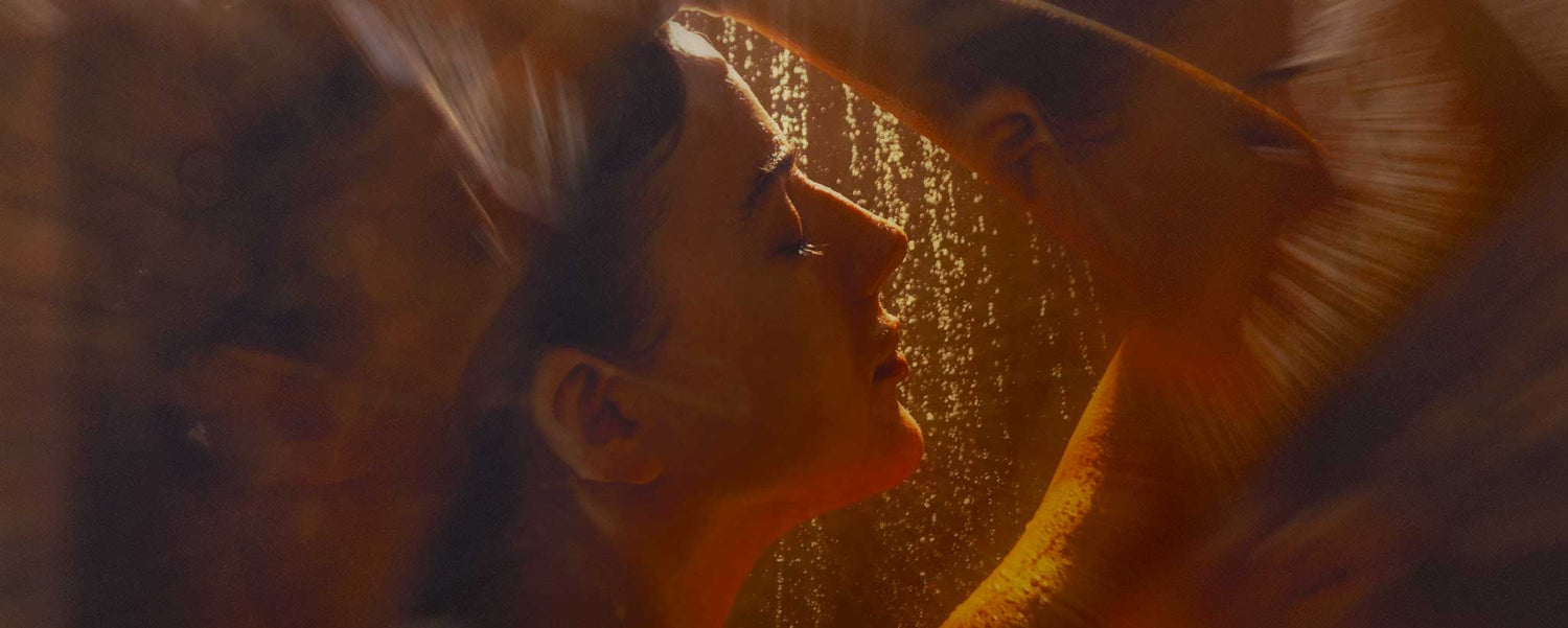 A female face profile while showering.