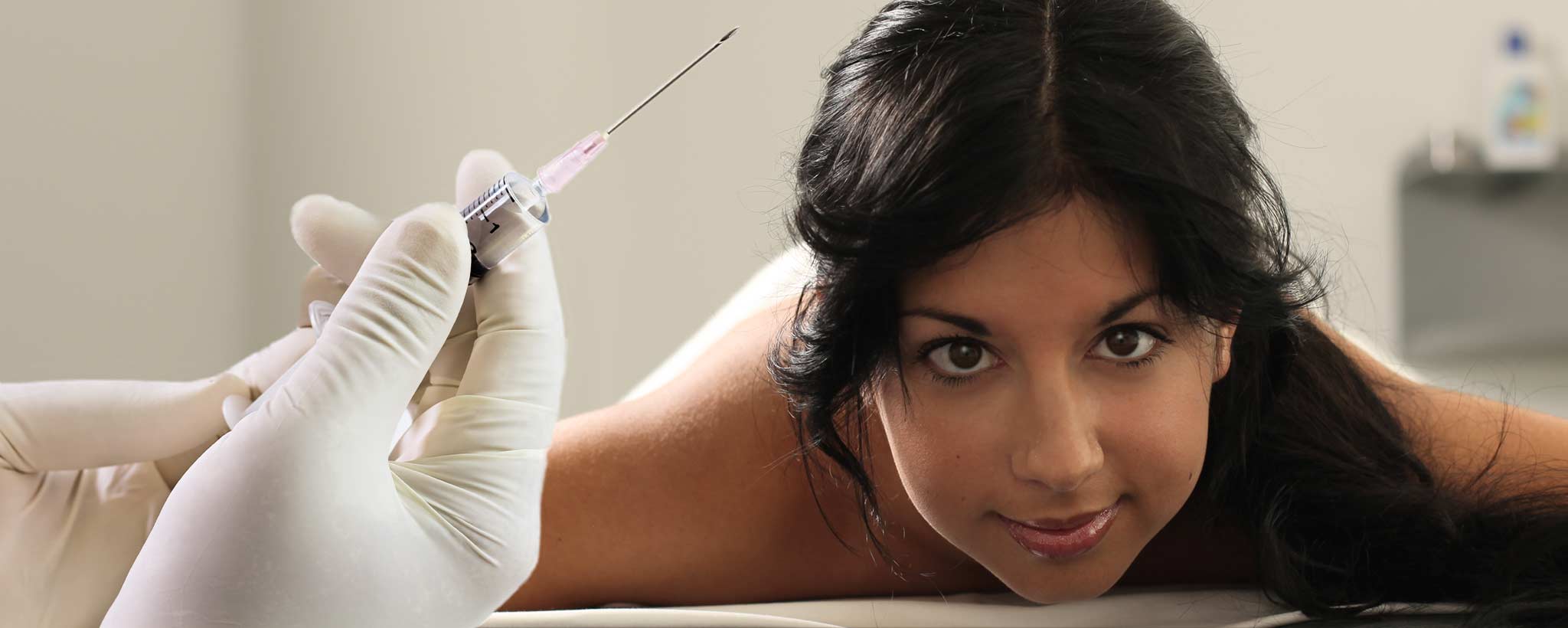 'Woman laying on stomach for prolotherapy'