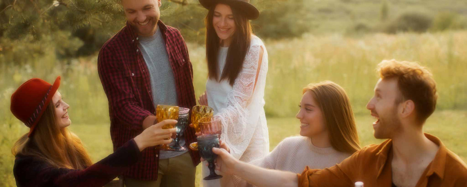 A group of rural townspeople celebrate outdoors.