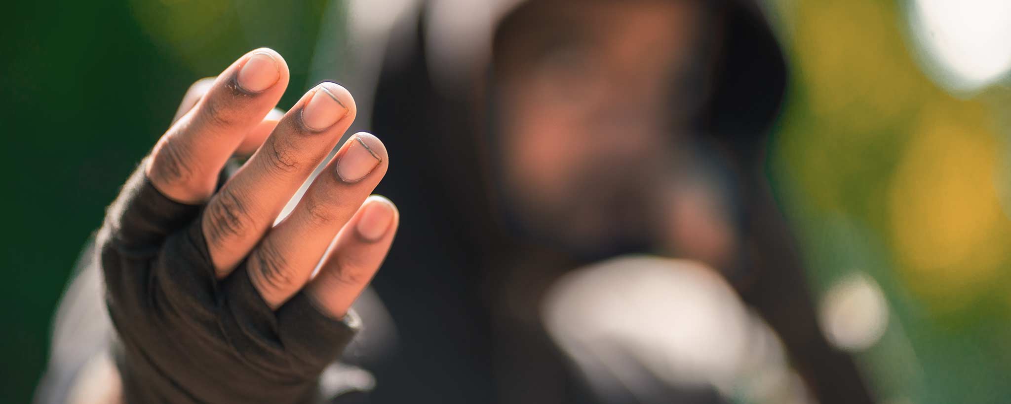 'A male hooded street fighter beckons a challenge.'