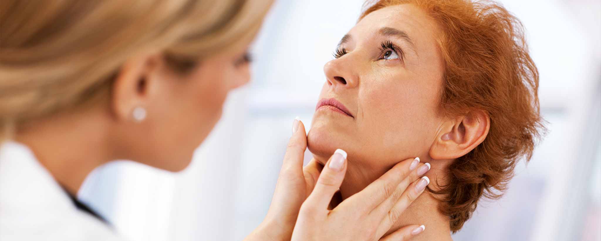 'Woman getting thyroid checkup'