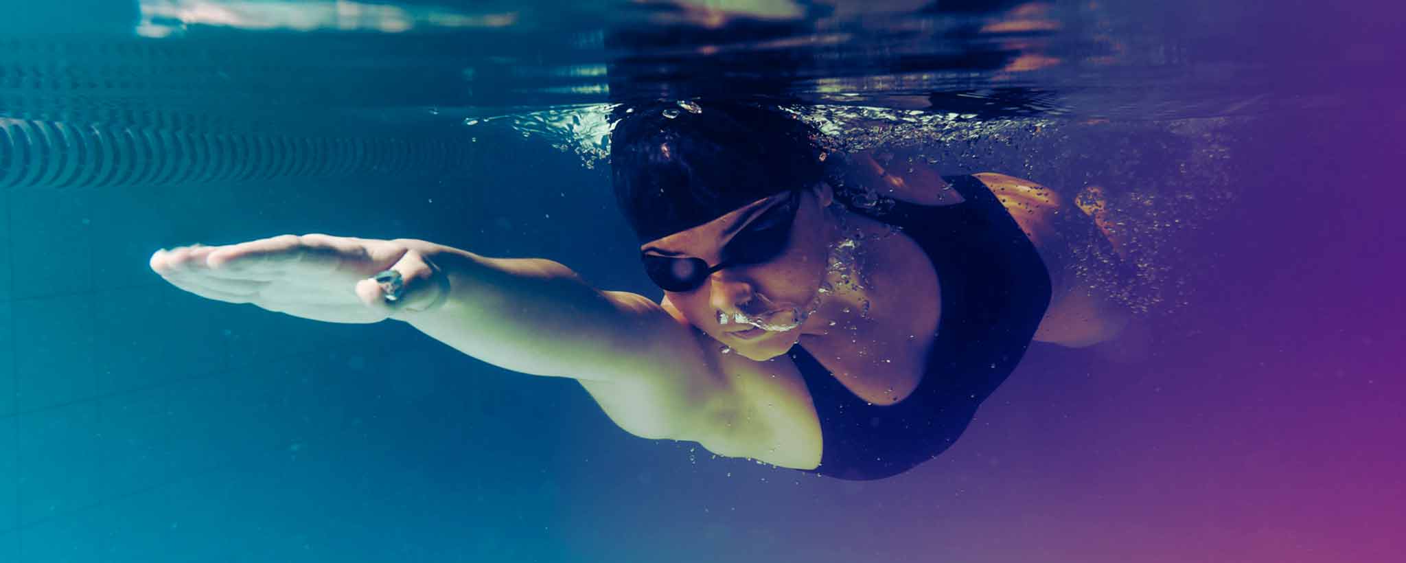 'An underwater female swimmer.'