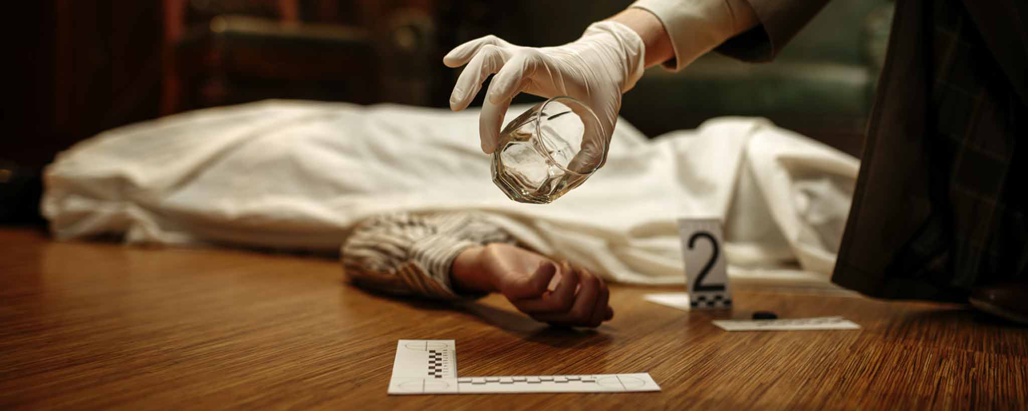 'Victim covered with sheet on floor'