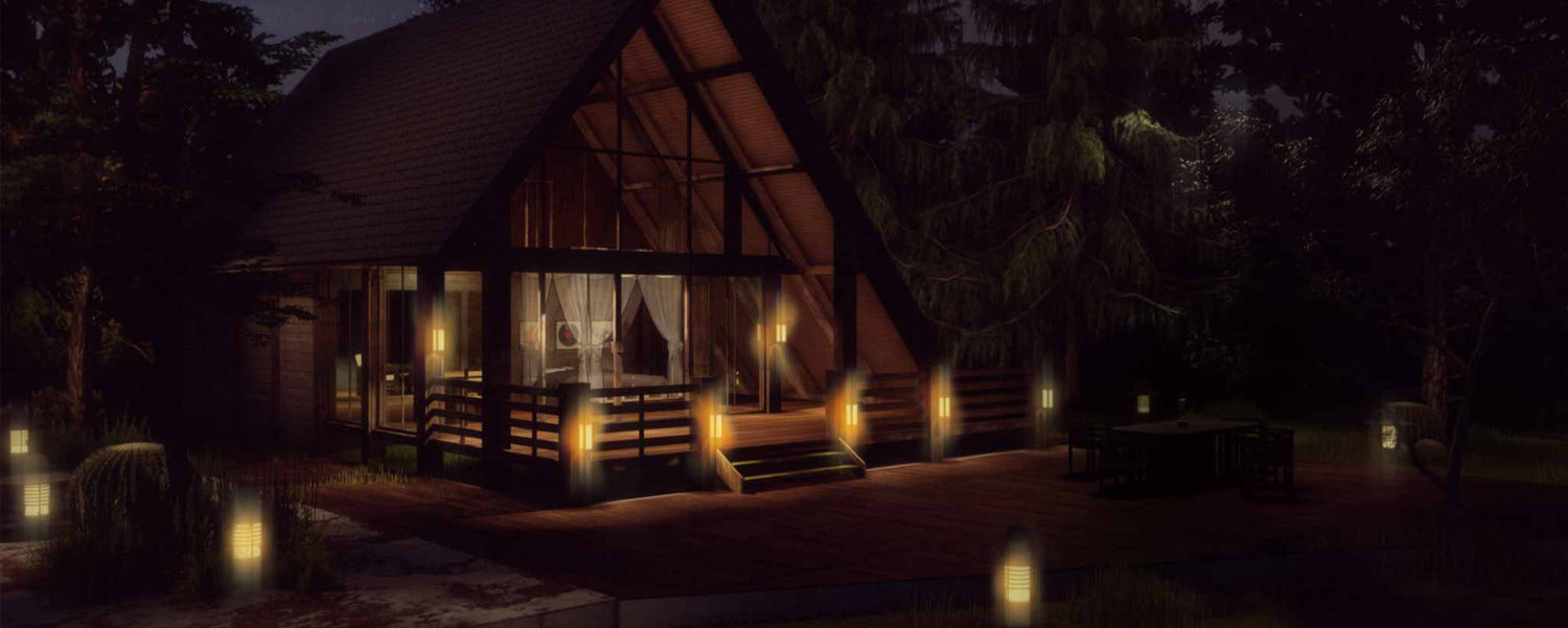 A wooden cabin in the forest with tiki torches around it.