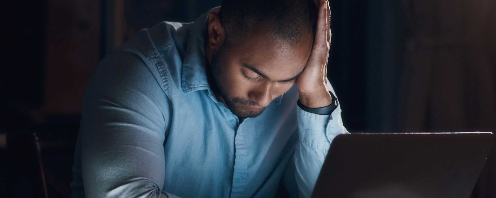 'Worried man at computer'