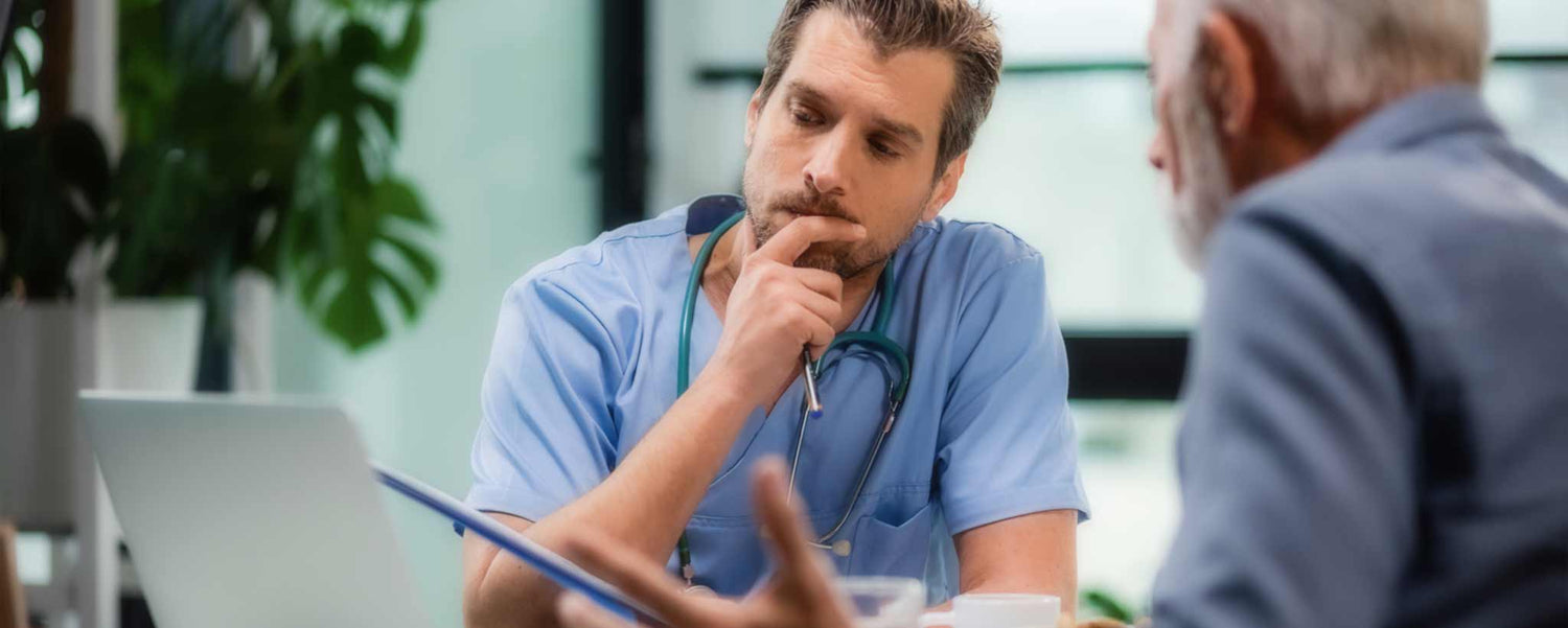 Doctor reviewing medical records with patient
