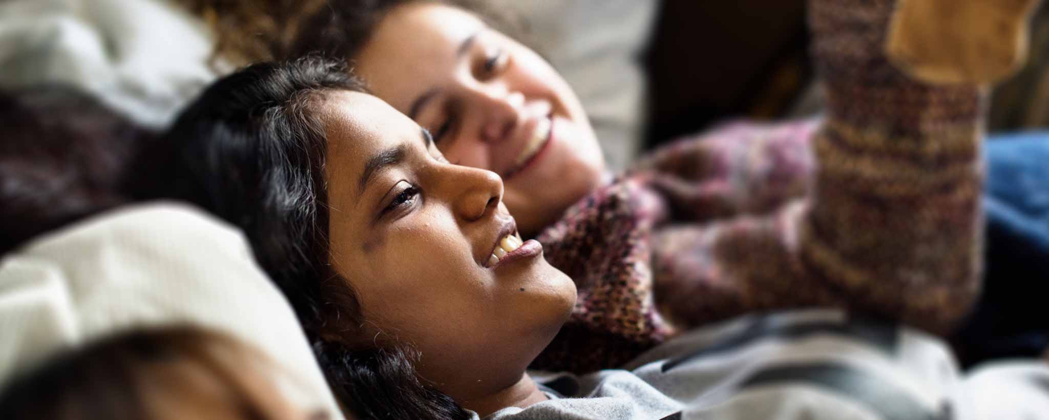 'Two reclining foster care girls.'