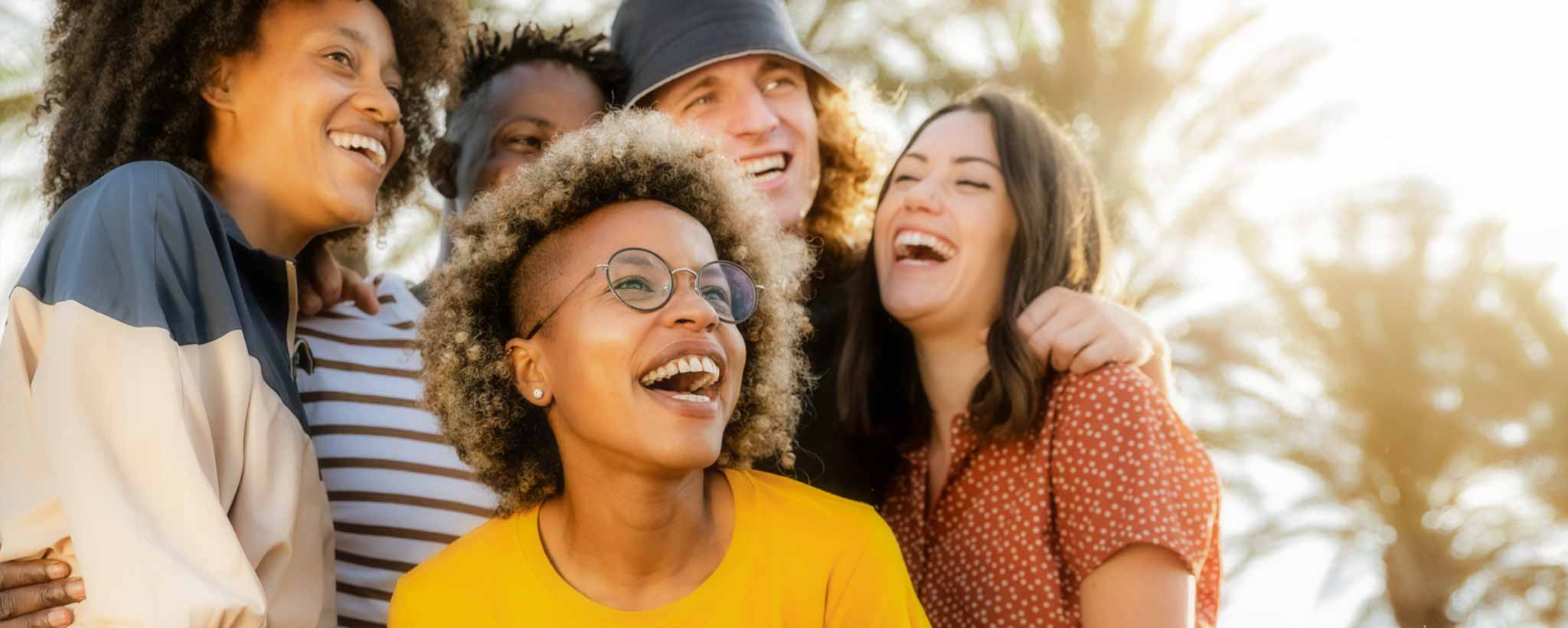 'Multiracial friends laughing together'