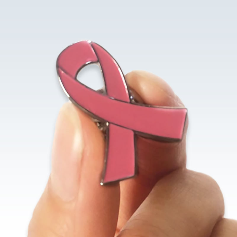 Holding Pink Ribbon Breast Pin